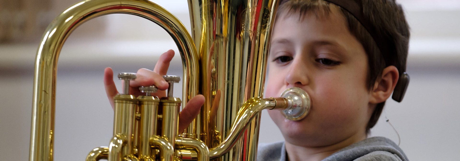 Deaf boy playing a tuba Deaf boy playing a tuba