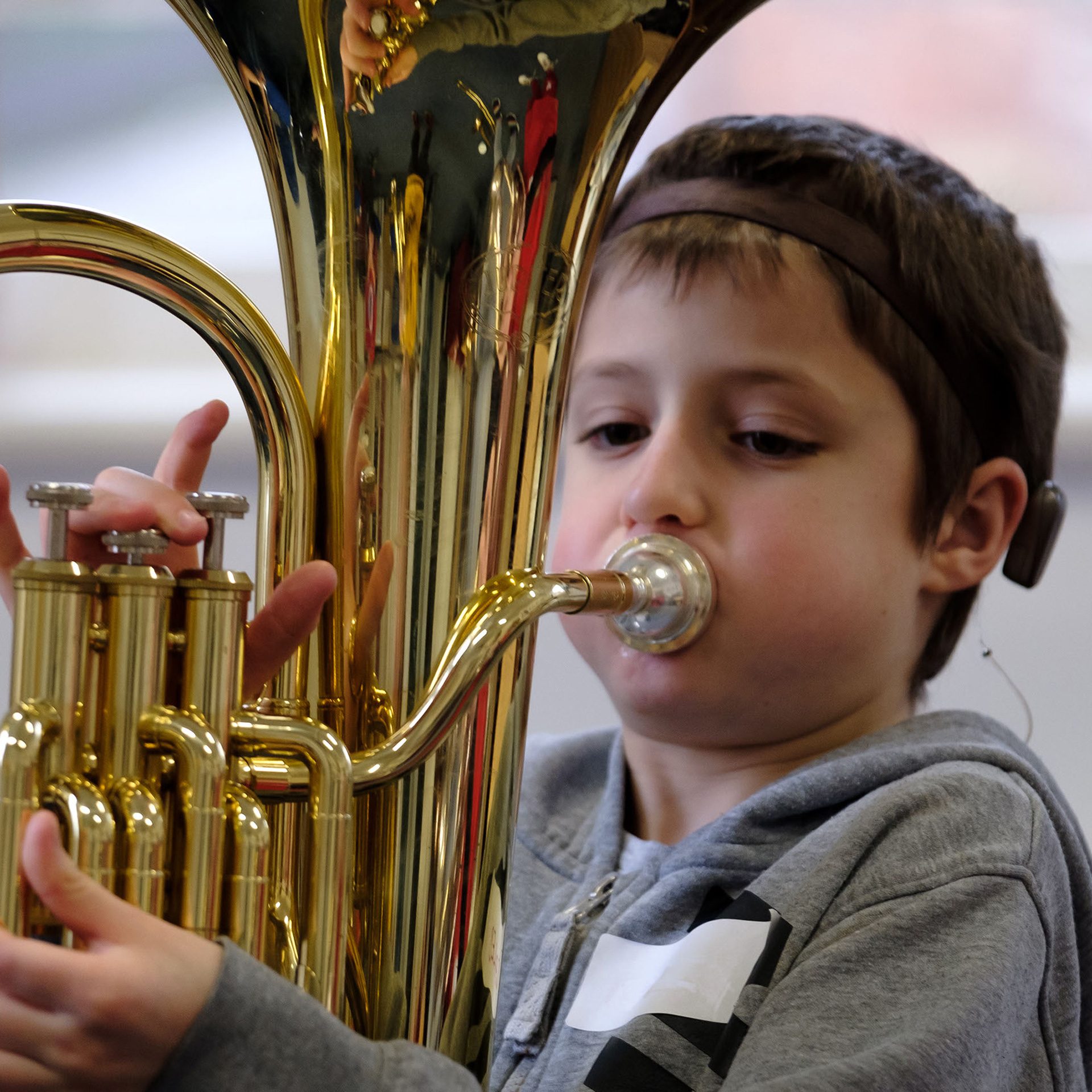 Deaf boy playing a tuba Deaf boy playing a tuba